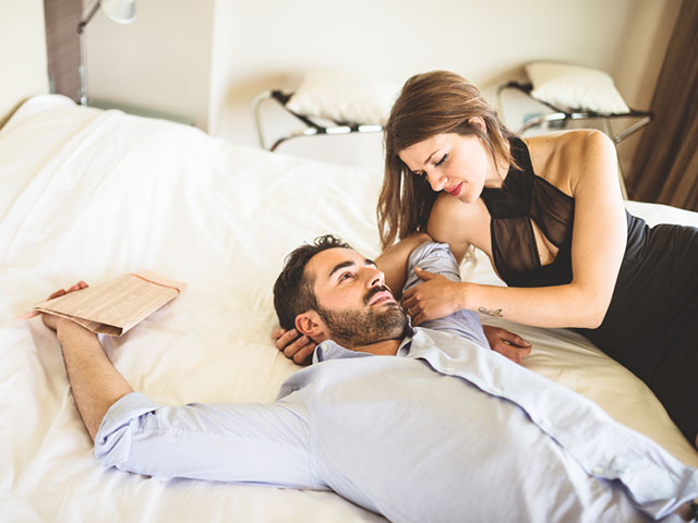 lovers relaxing on the bedroom